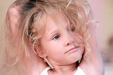 portrait of a beautiful little girl with blond hair