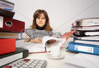 Female accountant very busy in office