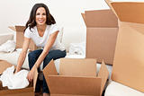 Single Woman Unpacking Boxes Moving House