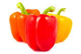 Orange, red and yellow peppers on a white background