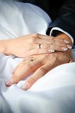 close-up of caucasian couple's hands with wedding rings