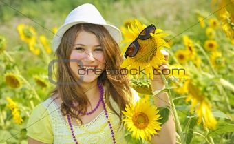 Beauty teen girl and sunflowers