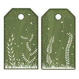 Green tags or labels with white flowers
