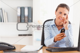 Young businesswoman using her mobile phone