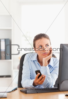 Portrait of a working woman with her cellphone