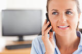 Close up of a working woman on the phone