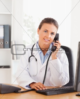 Portrait of a serious female doctor on the phone