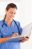 Close up of a doctor with stethoscope and folder