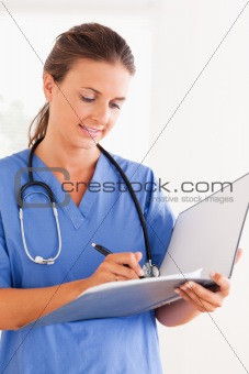 Close up of a doctor with stethoscope and folder