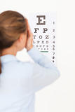 Woman looking at an eye test 