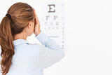 Brunette woman making an eye test 