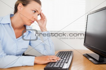 A woman looking to pc-screen in office