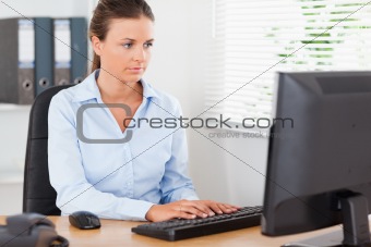 Businesswoman is typing in office