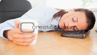 Businesswoman sleeping in office