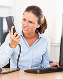 Annoyed businesswoman in office