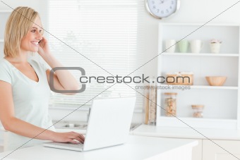 Woman with laptop and phone
