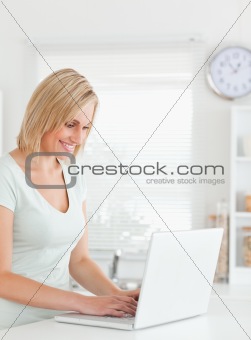 Blonde woman with a laptop