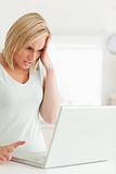 Woman looking at her laptop not knowing what to do