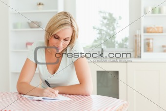Charming woman proof-reading a text