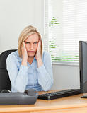 Frustrated working woman looking into camera