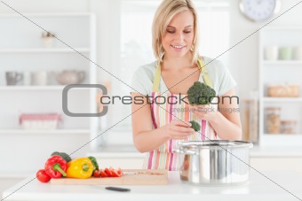 Woman cooking broccoli