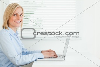 Gorgeous woman working on laptop