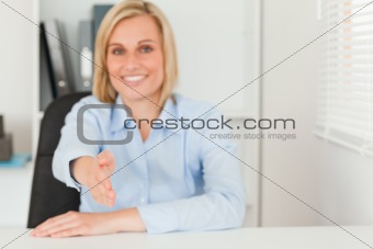 Businesswoman giving hand 