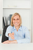 Smiling businesswoman giving hand 