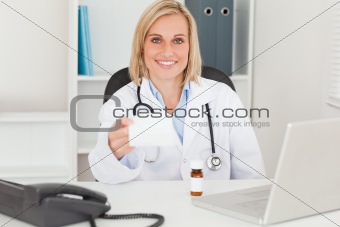 Doctor holding prescription