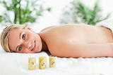 Blonde woman lying on massage lounger