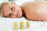 Blonde smiling woman lying on massage lounger