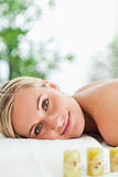 Blonde smiling woman relaxing on massage lounger