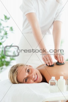 Blonde woman experiencing a stone therapy