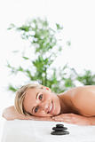 Smiling woman lying on a lounger 
