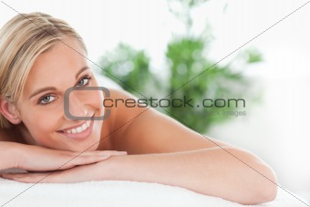 Close up of a blonde woman lying on a lounger