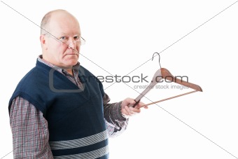Confident man in glasses holds in hand empty cloth hanger