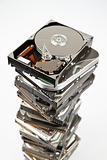 Stack of hard drive with opened one on top