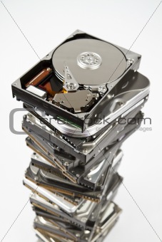 Stack of hard drive with opened one on top