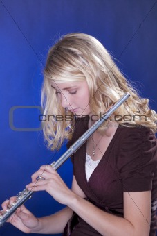Flute Player Isolated on Blue