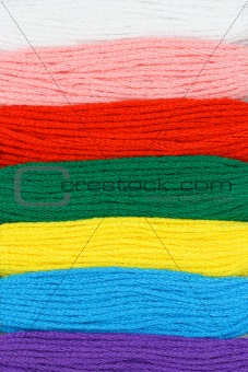 Multicolor embroidery threads background