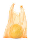 Yellow pear in orange plastic bag 