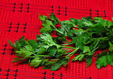 Parsley on red tablecloth