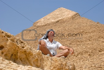 Man tourist by pyramid in Egypt