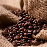 Focus on Coffee beans on burlap fabric