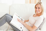 Blonde woman with a magazine
