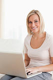 Portrait of a blonde woman using a laptop
