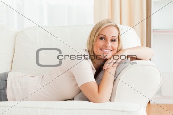 Calm woman lying on her sofa