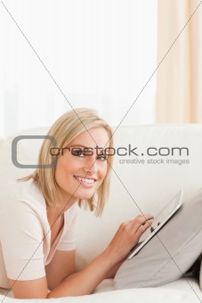 Portrait of a beautiful woman with a tablet computer