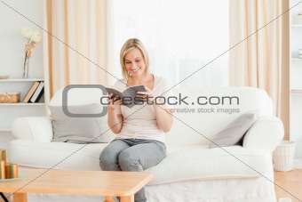 Blond-haired woman reading a book