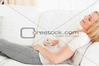 Laughing woman watching television